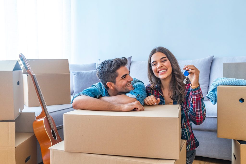 Young couple celebrating their first home.